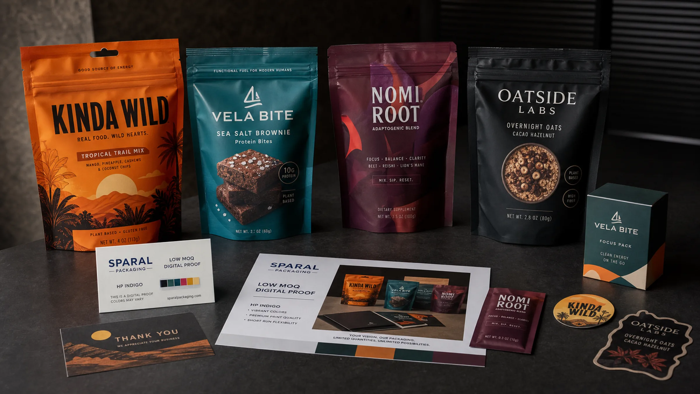 Cinematic low MOQ packaging system with bold retail-ready stand-up pouches, box, labels, insert card, sachets, and a Sparal Packaging digital proof sheet.