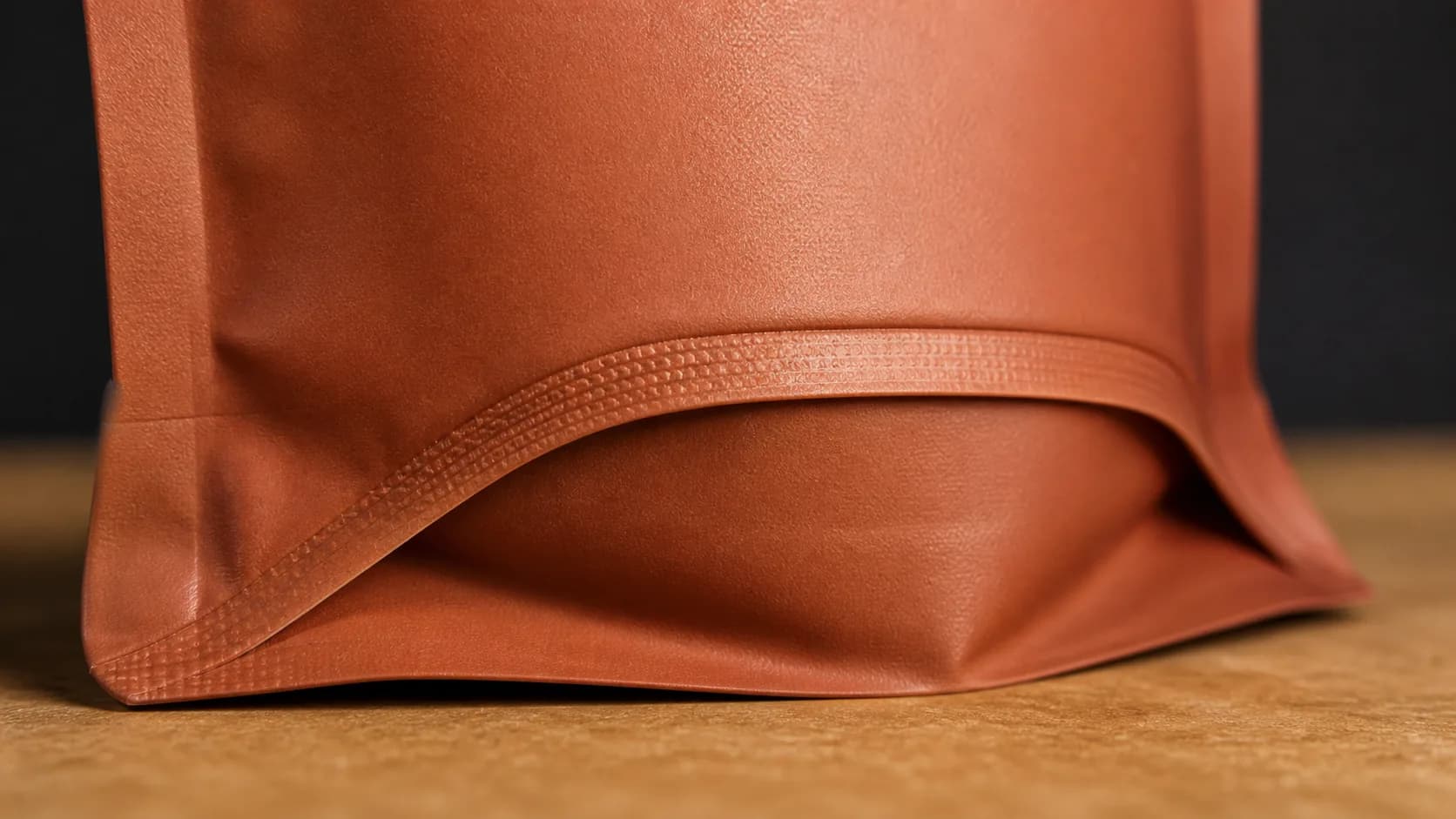 Stand-up pouch doypack bottom gusset standing on a counter — structural macro by Sparal Packaging